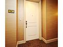 View of a condo's front door with the number 1604 and neutral colored walls and carpet in the hallway at 2305 Edgewater Dr # 1604, Orlando, FL 32804