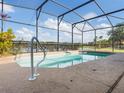 Relaxing screened pool with a sleek metal frame and clear water, perfect for enjoying sunny days at 2803 Boating Blvd, Kissimmee, FL 34746