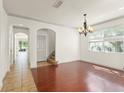 Elegant dining room with hardwood floors and a chandelier, perfect for gatherings and entertaining at 3752 Cleary Way, Orlando, FL 32828