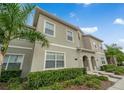 Charming two-story home with a well-maintained lawn and lush landscaping at 4983 Windermere Ave, Kissimmee, FL 34746