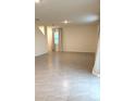 Open living room featuring tile flooring and neutral walls at 5168 Greenheart Ave, Mount Dora, FL 32757