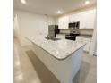 Bright kitchen features granite counters, stainless steel appliances, and tiled floors at 5216 Greenheart Ave, Mount Dora, FL 32757