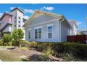 View of a house, highlighting its siding, symmetrically placed windows, and well-maintained outdoor space at 9443 Merrifield St, Orlando, FL 32827