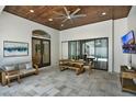 Covered patio area featuring tile floors, outdoor dining, a ceiling fan, and access to the pool at 9743 Covent Garden Dr, Orlando, FL 32827