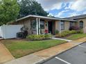 Well-maintained home featuring a landscaped yard and inviting entrance at 207 Esplanade Way # 101, Casselberry, FL 32707