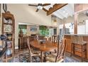 Cozy dining area features vaulted ceilings, an antique dining set, and seamless flow to the kitchen and living spaces at 1632 Oriole Ave, Orlando, FL 32803