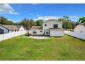 Large backyard featuring a white fence at 1668 Spicewood Ln, Casselberry, FL 32707
