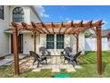 Cozy pergola with stone pavers and seating for four at 1668 Spicewood Ln, Casselberry, FL 32707