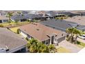 A beautiful aerial view of the home showcasing the manicured lawn and neighborhood at 2126 Ridge Pointe Ln, Clermont, FL 34715