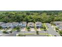 Expansive aerial view of single-Gathering homes in a well-maintained suburban neighborhood at 2159 Marsh Sedge Ln, Winter Park, FL 32792