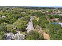 An aerial view shows the neighborhood's lush greenery, well-maintained homes and serene environment at 220 Wimbledon Cir, Lake Mary, FL 32746