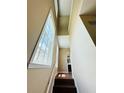 Stairway leading upstairs with wood steps, light walls, and tall windows that bring in lots of light at 276 Celebration Blvd, Celebration, FL 34747