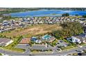 An aerial view of a community, with a pool and lake nearby for recreation and enjoyment at 3294 Hanging Tide St, Winter Garden, FL 34787