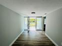 Entryway with wood-look floors and frosted glass sidelights next to front door at 412 Editha Cir, Sanford, FL 32771