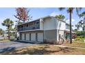 Exterior corner unit condo with three-car garage, patio, and green space at 4465 Ring Neck Rd # C, Orlando, FL 32808