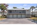 Three car garages can be found underneath second story condos with screened in patios at 4465 Ring Neck Rd # C, Orlando, FL 32808
