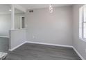Open-concept living space with gray walls and gray flooring for easy living at 4739 Elkmont Rd, Orlando, FL 32808