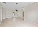 Bright and airy living room with neutral walls and tile flooring at 504 Delido Way, Kissimmee, FL 34758