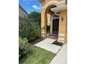 Home entrance with walkway and landscape at 508 Royal Tree Ln, Oviedo, FL 32765