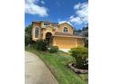 Two-story home with attached garage and landscaped front yard at 508 Royal Tree Ln, Oviedo, FL 32765
