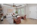 Bright living room with neutral tones, modern furniture, and ample natural light at 540 Seven Oaks Blvd, Winter Springs, FL 32708