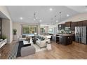 Bright, open living space featuring a stylish kitchen, dining area, and a view of the pool at 7017 Bridle Path, St Cloud, FL 34771