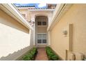 Inviting walkway with garden beds leading to the front of the house at 8539 Via Bella Notte, Orlando, FL 32836