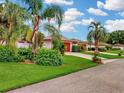 A charming street view of single-story homes with well-maintained lawns and landscaping on a sunny day at 9 Abbey Ct, Haines City, FL 33844