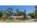 Inviting single-story home featuring a neatly landscaped front yard and classic design at 131 Lake Charles Rd, Deland, FL 32724
