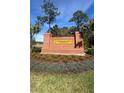 Fountain View of Ormond Beach entrance sign with brick facade and well-manicured landscaping at 1351 Morning Walk Dr, Ormond Beach, FL 32174