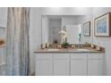 Bright bathroom features double sinks, granite countertops, and a shower-tub combination at 3896 Diving Dove Ln, Bartow, FL 33830