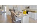 Modern kitchen with granite countertops, stainless steel appliances, plus seating at the island at 3908 Diving Dove Ln, Bartow, FL 33830