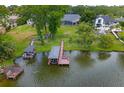 Expansive backyard leading to a private dock on the lake, offering direct water access at 5108 Sailwind Cir, Orlando, FL 32810