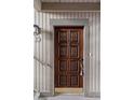Attractive front door featuring decorative wood panels and charming details at 652 Lake Villas Dr # D, Altamonte Springs, FL 32701