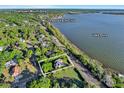 Stunning aerial view of lakeside home near Downtown Mount Dora and the Mount Dora Yacht Club at 996 Fairview Ave, Mount Dora, FL 32757