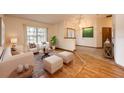Bright living room with neutral furniture, a large window and views of the outdoors at 1130 Woodchuck Ct, Orange City, FL 32763