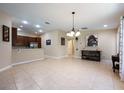 Open-concept living area with tile flooring, recessed lighting, and seamless flow to the kitchen and dining spaces at 11908 Fiore Dr # 1, Orlando, FL 32827