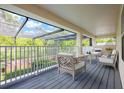 Relaxing covered patio area with comfortable seating, perfect for outdoor enjoyment at 16500 Cedar Run Dr, Orlando, FL 32828