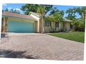 Inviting exterior view of home featuring a brick driveway and nicely manicured lawn at 3606 Palm Ave, Apopka, FL 32703