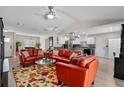 Bright, open-concept living room featuring stylish furniture, and seamless flow to the kitchen at 3606 Palm Ave, Apopka, FL 32703