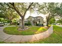 Two-story home with mature landscaping at 4448 Riverton Dr, Orlando, FL 32817