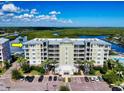 Lovely waterfront condo building offering serene views, beautiful landscaping, and convenient parking spaces at 5 Riverwalk Dr # 601, New Smyrna Beach, FL 32169