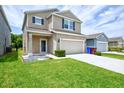 Lovely two-story home boasting a manicured front yard and a convenient two-car garage at 5164 Chickadee St, St Cloud, FL 34771