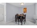 Cozy dining area featuring tile floors, and modern lighting creating a warm atmosphere at 6100 Westgate Dr # 101, Orlando, FL 32835