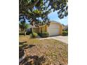 Inviting single-Gathering home with a well-kept lawn, and a spacious two-car garage at 7228 Spring Villas Cir, Orlando, FL 32819