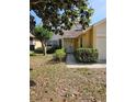 Welcoming front entrance featuring manicured shrubs and a quaint pathway to the front door at 7228 Spring Villas Cir, Orlando, FL 32819