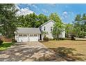 This property has a three-car garage and lush landscaping at 101 W Oakland Ave, Oakland, FL 34760