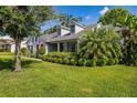 Charming single-Gathering home with lush lawn, mature trees, and covered porch at 1133 Brandy Lake View Cir, Winter Garden, FL 34787