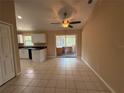 Bright dining area with tile floors, slider doors to patio and entry to kitchen at 1931 N Portillo Dr, Deltona, FL 32738