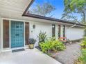 Charming home exterior with a stylish front door, well-maintained landscaping, and a welcoming pathway at 2350 Worthington Rd, Maitland, FL 32751
